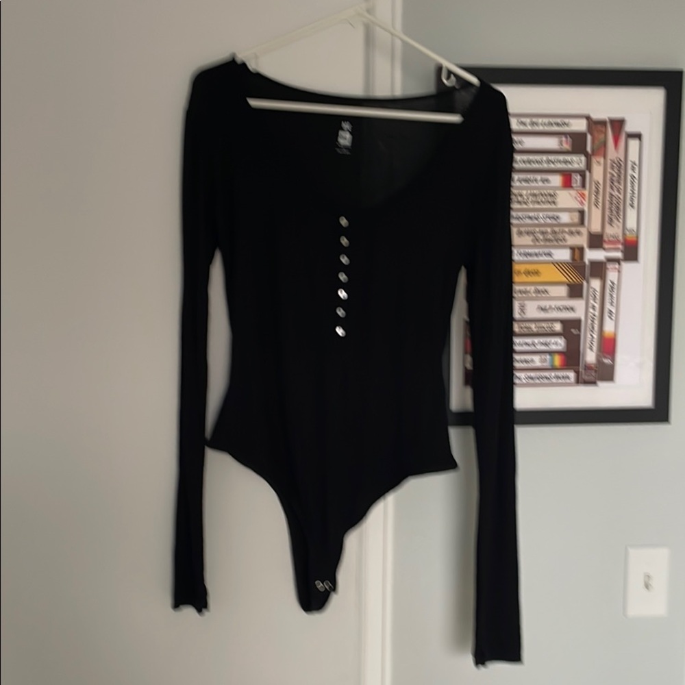 ME TO WE Long Sleeve Bodysuit with vertical rib style. Mother of pearl buttons.